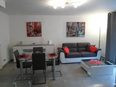 a living room with a couch and a table at Promenade Gambetta in Nice
