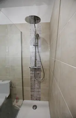 a shower with a glass door in a bathroom at Splendid apart in the heart of Nice in Nice