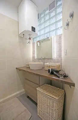 a bathroom with a sink and a mirror at Splendid apart in the heart of Nice in Nice