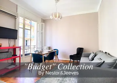 a living room with a couch and a table at Nestor&Jeeves - LILAS BUFFA - Central - Close sea - Top Floor in Nice
