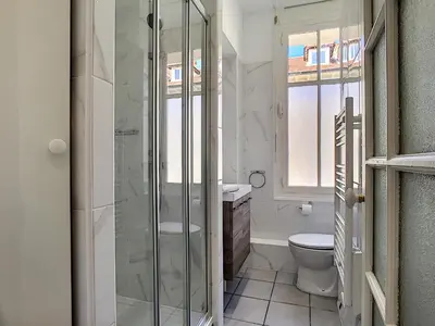 a bathroom with a toilet and a glass shower at Nestor&Jeeves - LILAS BUFFA - Central - Close sea - Top Floor in Nice