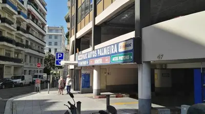 a building with a street sign in a city at Le Catinat in Nice