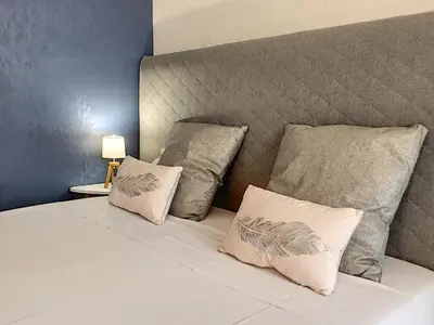 a white bed with two pillows on top of it at Nestor&Jeeves - NEVADA SUITE - Central - Close sea in Nice