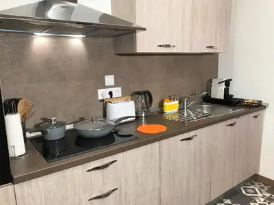 a kitchen counter with pots and pans on a stove at Rigoletto Massena in Nice