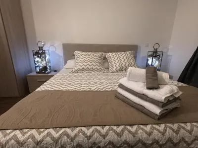 a bedroom with a bed with towels on it at Rigoletto Massena in Nice