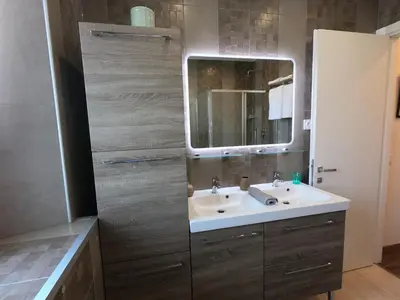 a bathroom with a sink and a mirror at Rigoletto Massena in Nice