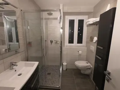 a bathroom with a shower and a toilet and a sink at Coccinelle in Nice