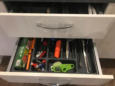 a drawer filled with tools in a cabinet at Chouette Massena in Nice