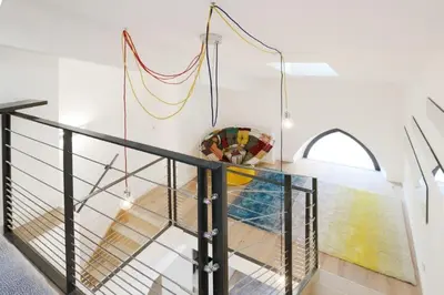 a staircase with a glass railing with at Patio Wilson in Nice