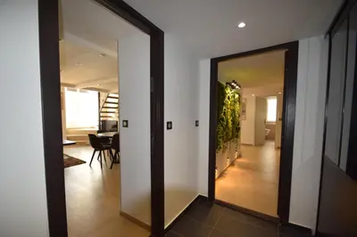 a hallway with a door leading to a living room at Perla Duplex - No Better Location In Nice in Nice
