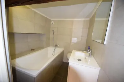 a bathroom with a tub and a toilet and a sink at Perla Duplex - No Better Location In Nice in Nice