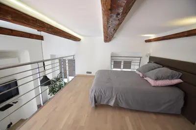 a bedroom with a bed and a balcony at Jade Duplex - No Better Location In Nice in Nice