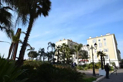a street with palm trees and a building at Jade Duplex - No Better Location In Nice in Nice