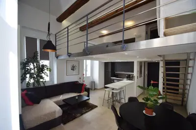 a living room with a couch and a table at Jade Duplex - No Better Location In Nice in Nice