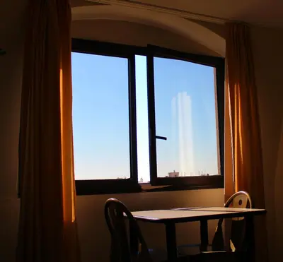 a table in front of a window with a view of the city at Cosy - Negresco - AC - 5 min walk to Beach in Nice