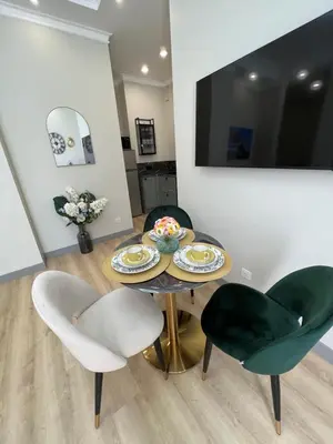 a dining room with a table and two chairs at Amour-35 in Nice
