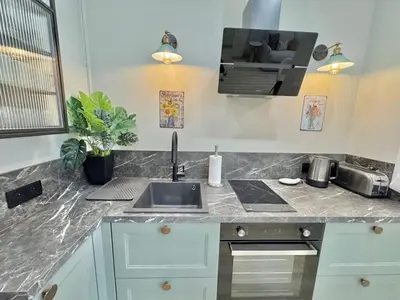 a kitchen with a sink and a counter top at Amour-35 in Nice