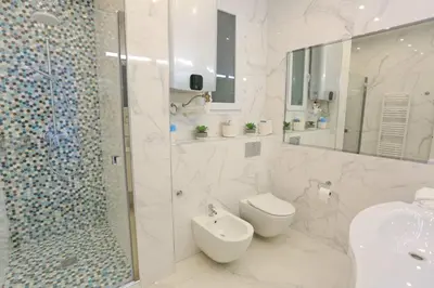 a bathroom with a toilet and a shower and a sink at Le Charme-35 in Nice
