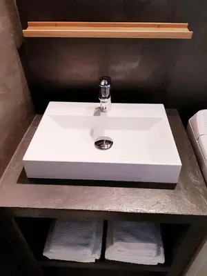 a white sink in a bathroom with towels at Cosy central studio Nice Rossini large balcony in Nice
