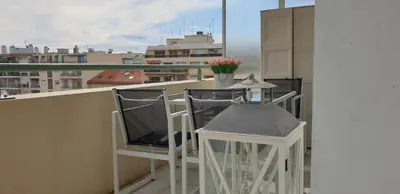a balcony with a table and chairs on a balcony at Alery apartment Nice terrace AC wifi by Affitto-Nizza in Nice