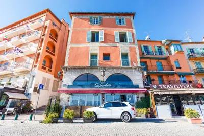 a white car parked in front of a building at ON VILLEFRANCHE BAY - AP3040 by Riviera Holiday Homes in Villefranche-sur-Mer