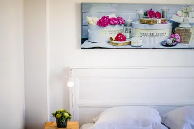 a shelf above a bed with flowers on it at Palais l'Escurial AP4069 by Riviera Holiday Homes in Nice