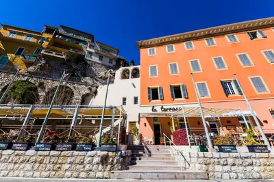 a group of buildings with stairs in front of them at Quai des Marinières AP2015 by Riviera Holiday Homes in Villefranche-sur-Mer