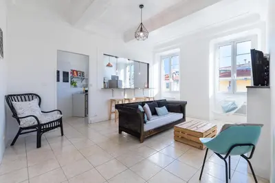 a living room with a couch and a chair at Bright Apartment Old Town in Nice