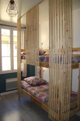 a bedroom with two bunk beds in a room at Bright Apartment Old Town in Nice