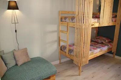 a room with two bunk beds and a chair at Bright Apartment Old Town in Nice