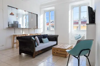 a living room with a couch and a chair at Bright Apartment Old Town in Nice