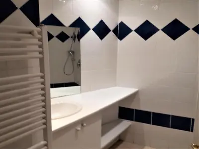 a white bathroom with a sink and a mirror at Elegant Seaside Villa in Èze in Èze
