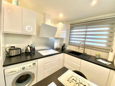 a kitchen with a sink and a washing machine at Eden Barmassa in Villefranche-sur-Mer
