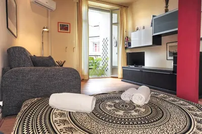 a living room with a couch and a table at Mini Suite Miro Five Stars Holiday House in Nice