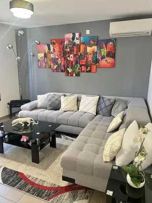 a living room with a couch and a table at DIEGO 4 pièces duplex in Nice