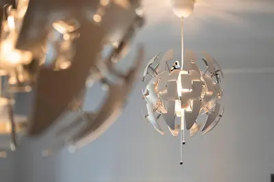 a chandelier hanging from a ceiling with lights at Nice Centre proche Mer Appartement Lumineux 6 Pers Idéal Famille Location éligible au Bail Mobilité Mobility Lease in Nice