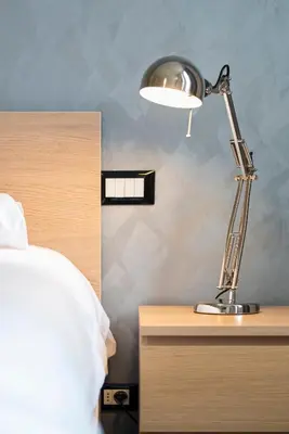 a lamp sitting on a table next to a bed at Nice Centre proche Mer Appartement Lumineux 6 Pers Idéal Famille Location éligible au Bail Mobilité Mobility Lease in Nice