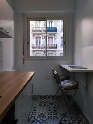 a kitchen with a desk and a window at Best Apart - Nice Port - Balcony in Nice