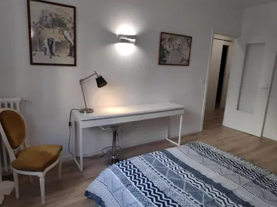 a bedroom with a desk and a bed and a lamp at Best Apart - Nice Port - Balcony in Nice