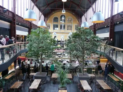a large building with tables and trees in it at STUDIO DECO DESIGN, HYPER CALME in Nice