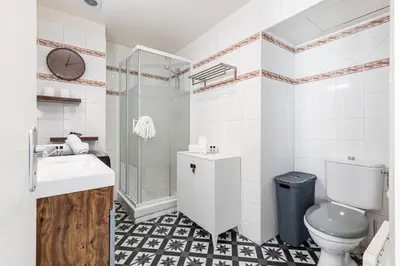 a bathroom with a toilet and a sink and a shower at COCOON BEACH Central Proche Mer in Nice