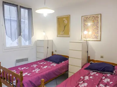 a bedroom with two beds and a window at Apartment Vieux Nice by Interhome in Nice