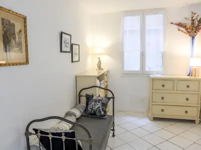 a room with a bed and a dresser and a window at Apartment Vieux Nice by Interhome in Nice