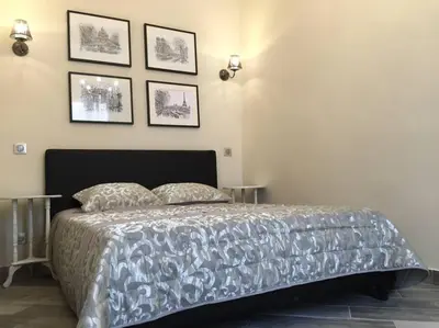 a bedroom with a bed with two pillows on it at Beautiful apartment Rue De La Croix Vieux Nice in Nice
