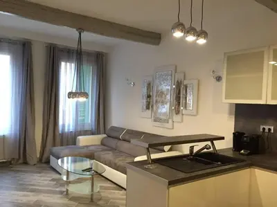 a living room with a couch and a table at Beautiful apartment Rue De La Croix Vieux Nice in Nice