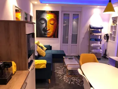 a living room with a couch and a table at California in Nice