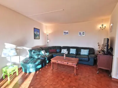 a living room with a couch and a coffee table at Holiday Home Agora by Interhome in Nice