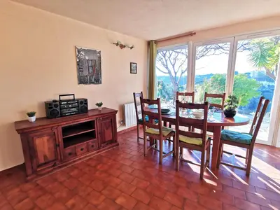 a dining room with a table and a microwave at Holiday Home Agora by Interhome in Nice