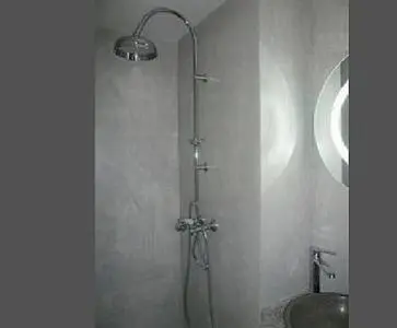 a shower in a bathroom with a sink at Appartement Les Plages in Nice