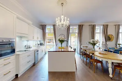 a kitchen and dining room with a dining table and a dining room at Silver Suite Five Stars Holiday House in Nice